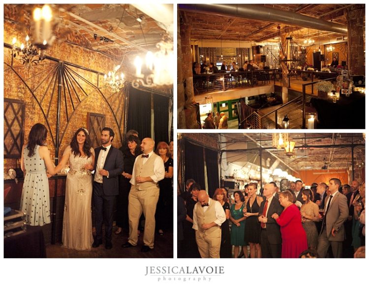 Wedding guests gathered inside rustic industrial wedding reception venue