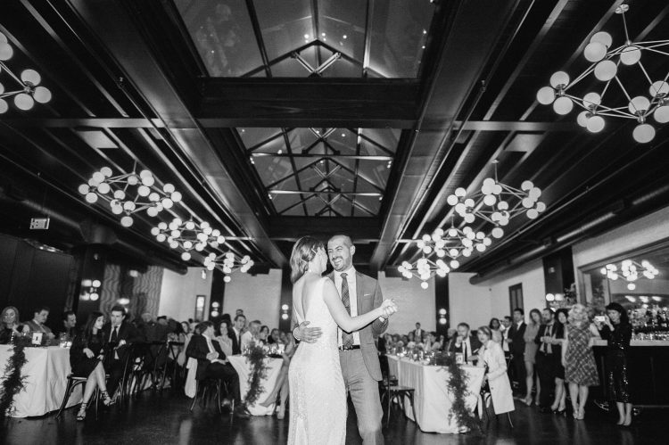 Bride and groom sharing their first dance in elegant reception hall