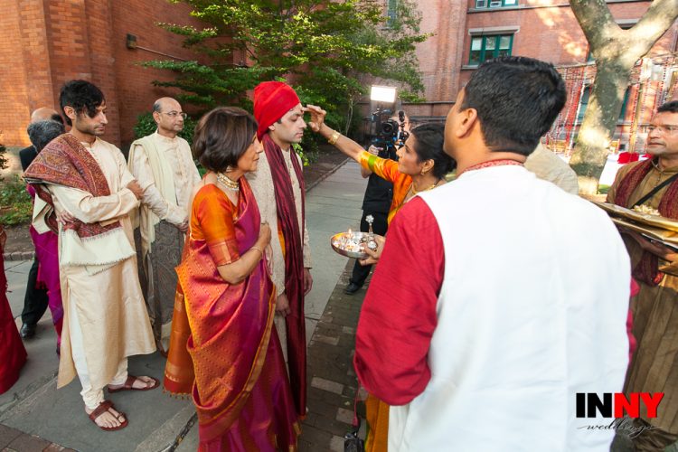 Traditional wedding blessing ceremony with family members gathered outdoors