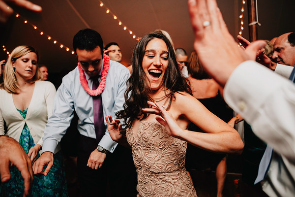 Wedding guest dancing during lively wedding reception celebration