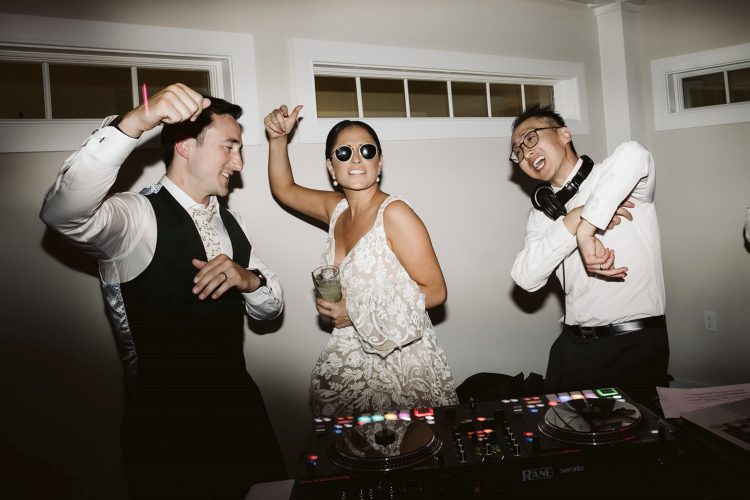 Bride and Groom dancing with DJ at the booth.