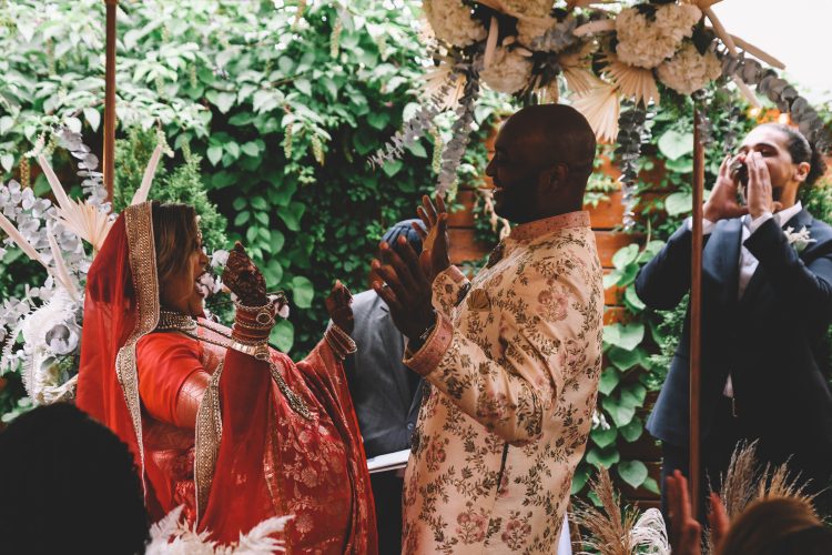 Bride and Groom celebrating during their wedding ceremony.