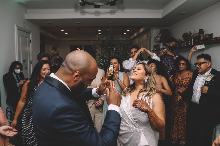 Bride and Groom dancing with guests during the reception.