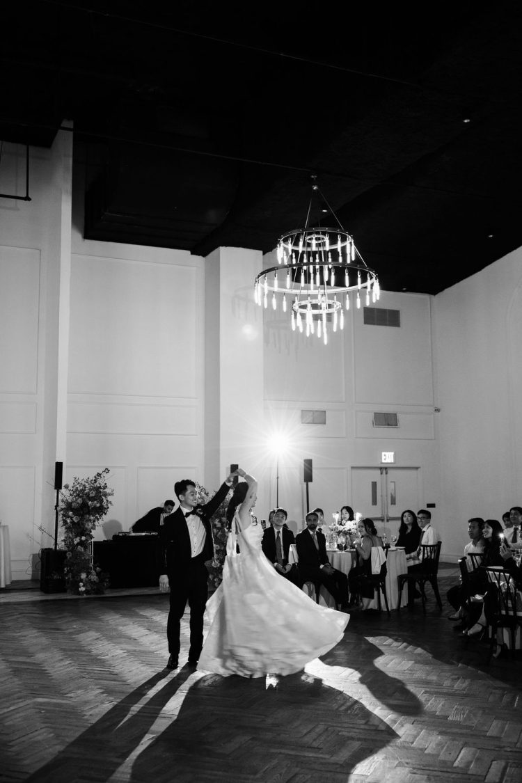 Couple twirling during their first dance.