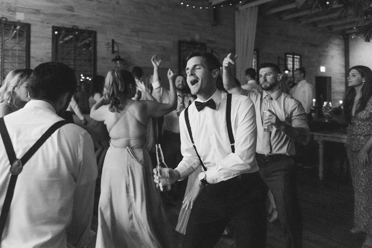 Guest singing and dancing on the dance floor.