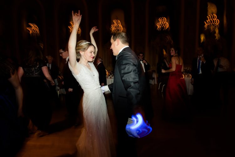 Bride and groom dancing together.