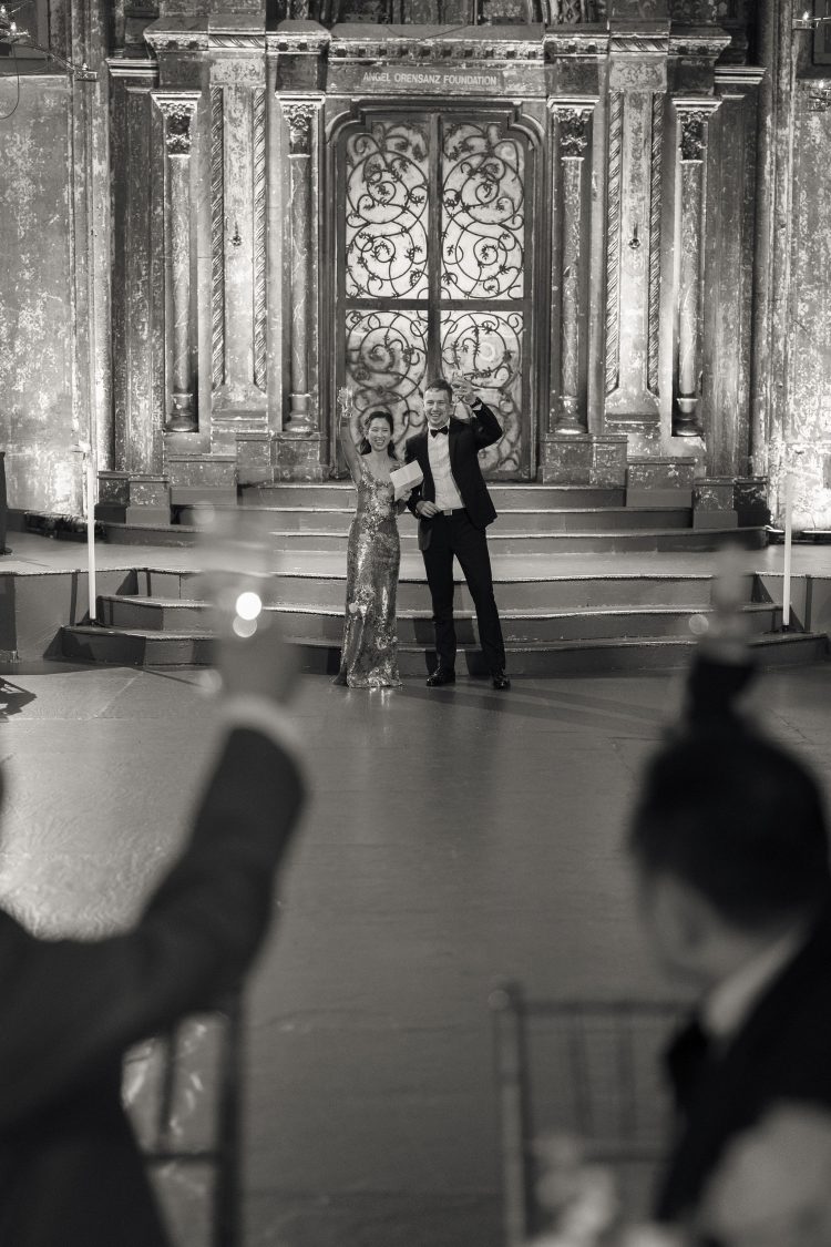 Couple standing on stage at a wedding reception at Angel Orensanz Foundation.