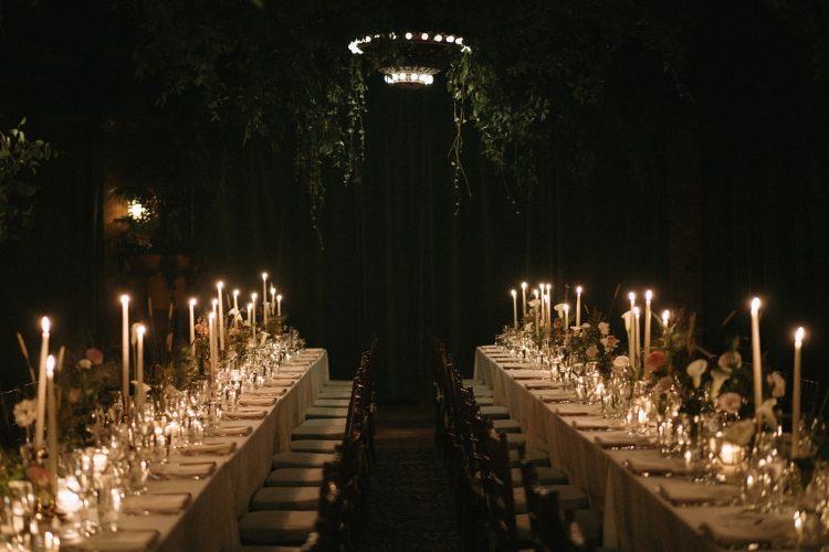 Candlelit wedding reception table setup at The Bowery Hotel.