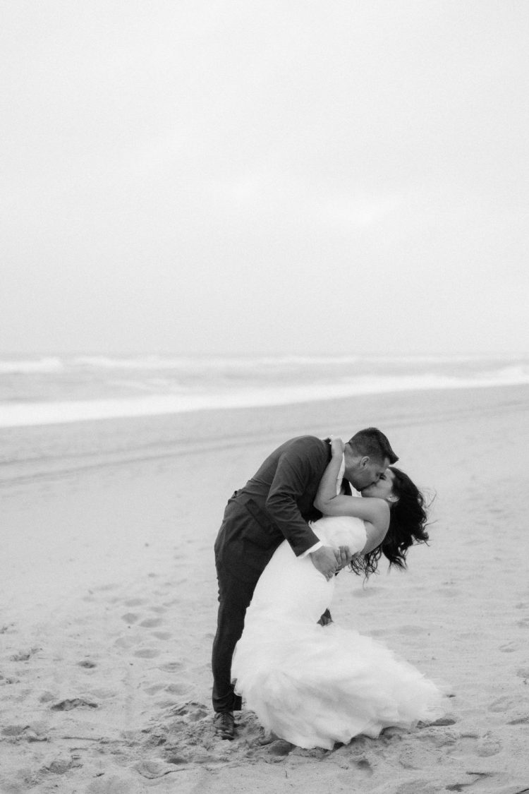 Couple kissing on the beach at Gurney’s Montauk Resort Long Island