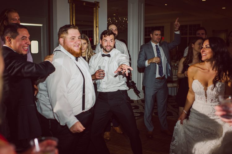Lively wedding reception moment with playful energy.