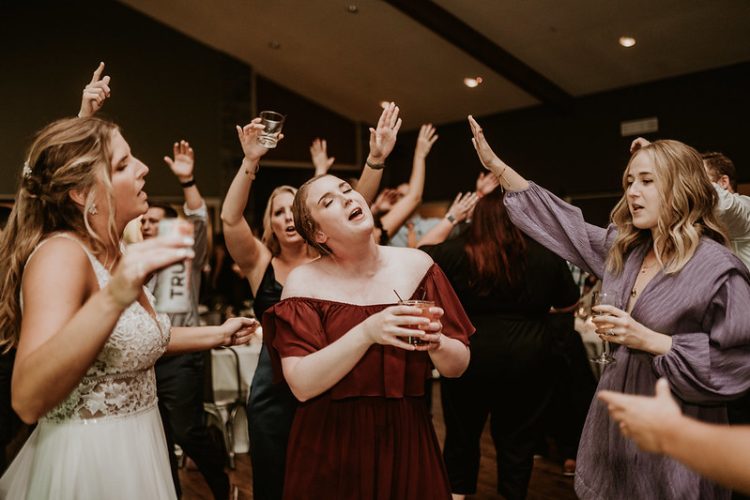 Fun wedding reception moment with everyone fully into the music.
