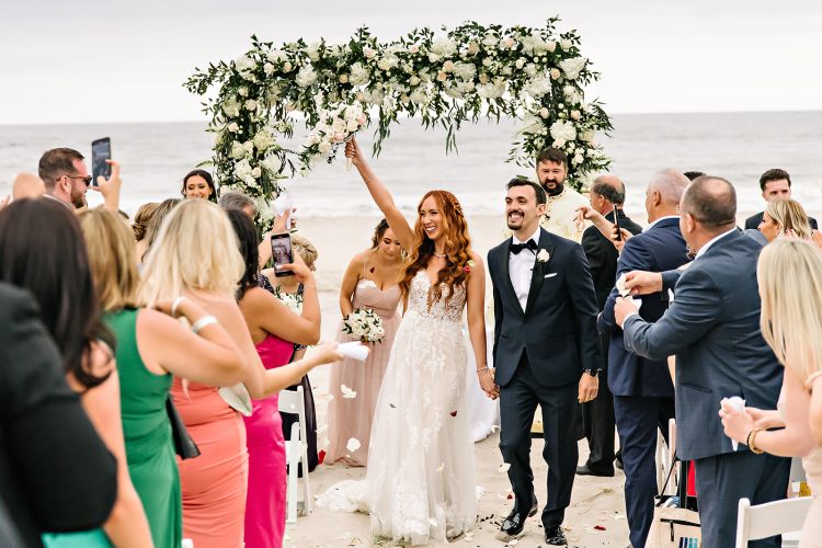 Joyful beach wedding ceremony moment, just married.
