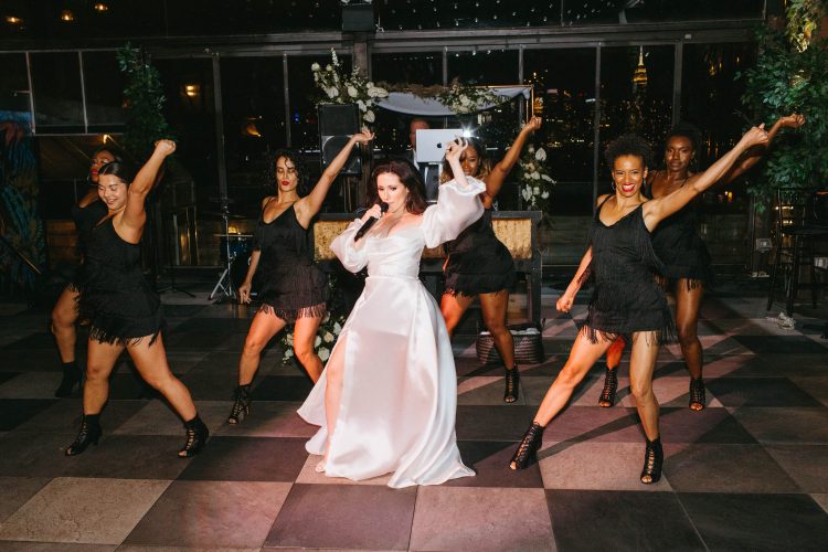 High energy wedding performance with the bride and dancers stealing the show.