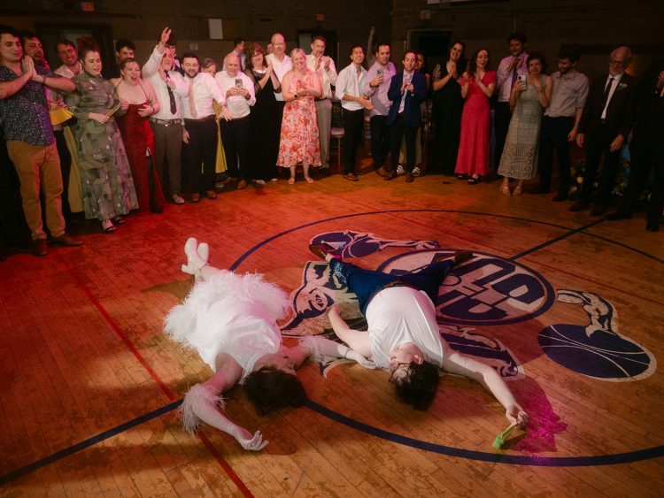 Hilarious wedding dance floor finale with everyone cheering them on.