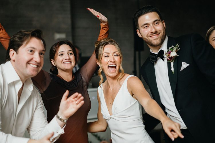 Bride and groom celebrating with guests during wedding reception