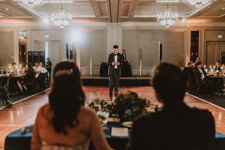 Wedding guest delivering a speech during an elegant reception